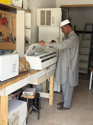 Rehmat HVAC technician at work repairing appliances